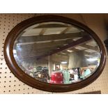 VICTORIAN OVAL MIRROR WITH MAPLE AND EBONY BANDING AND ORIGINAL BEVELLED EDGE GLASS