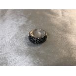 A SILVER RING DOME SHAPED FANCY DESIGN SIZE R