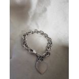 A TIFFANY AND CO LINK BRACELET WITH HEART COMES WITH POUCH