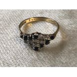 A 9CT GOLD DRESS RING SIZE O WHITE STONES POSSIBLY CZ