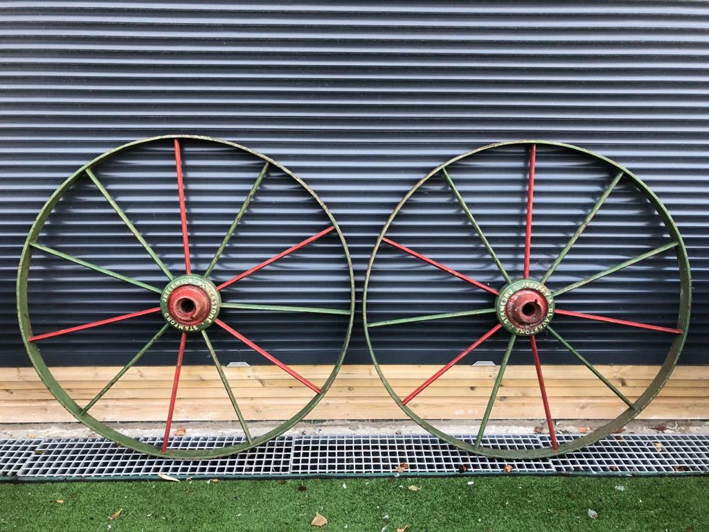 PAIR OF ANTIQUE CAST IRON RED AND GREEN WHEELS STAMPED JEFFERY AND BLACKSTONE