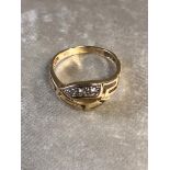 A 14CT GOLD AND DIAMOND DRESS RING AN UNUSUAL SET THREE DIAMONDS ON SIDE OF RING AND THE OTHER
