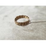 A 9CT GOLD ETERNITY RING WITH POSSIBLY SURROUNDING DIAMONDS WEIGHT 3.76G