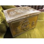 AN OLD BRASS WRAPPED DOME TOP COAL BOX WITH EMBOSSED ENGLISH GALLIONS AT FULL MASK