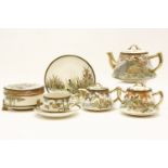 An early 20th century satsuma tea service, decorated with birds, together with a box and cover, etc