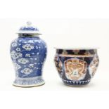 A large Chinese blue and white porcelain jar and cover, with flowering prunus tree decoration,