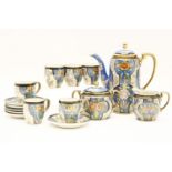 A Noritake coffee set, painted with panels of flowers