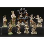 Sixteen various porcelain cherub figures, mostly Continental, and a Staffordshire group, 10-19cm