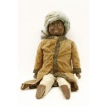 A Victorian Indian doll, with bisque head, composition body, bisque lower arms and legs, in turban