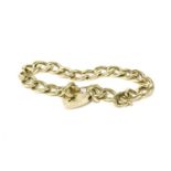 A 9ct gold curb link bracelet, with a 9ct gold padlock, engraved initials to padlock21.42g