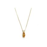 A gold marquise cut orange sapphire pendant, on a gold trace chain, marked 375, pendant tested as