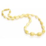 A single row of graduating late 19th century barrel shaped ivory beads,approximately 21g