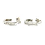 A pair of 9ct white gold diamond set tapered hoop stud earrings