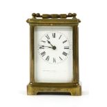 A brass cased carriage clock by Webster & Co & Jenner, platform escapement and white dial and key,