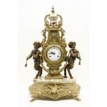 A Continental brass and onyx mantle clock, the white enamel dial with black Roman numerals and