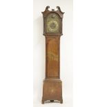 A 19th century inlaid oak eight day longcase clock, with a brass arched dial, lacking hood door,