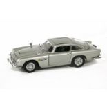 A Danbury Mint diecast model of James Bond 007 Aston Martin DB5, in metallic silver body