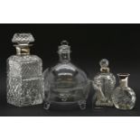 A quantity of cut glass decanters and perfume bottles, together with a pair of silver plated