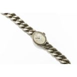 A ladies Continental silver Dugena mechanical bracelet watch with curb link braclet, c.1970,