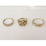 A 9ct gold single stone leaf spray opal ring, a 9ct gold diamond half hoop eternity ring, and a