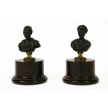 A pair of 19th century French bronze marble busts of Roman emperors, each on gilt metal socle and