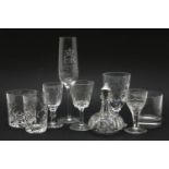 A large quantity of glassware, including champagne flutes, whisky tumblers, liqueur glasses, etc