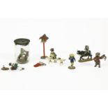 Eight Japanese cold painted bronze miniature figures, including a frog in a jam jar with fly, a