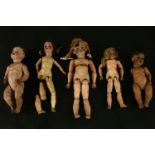 Five bisque head dolls, variously marked, most incomplete, one head damaged