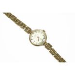 A ladies gold Rotary mechanical bracelet watch, with three row diamond cut gate bracelet, silvered