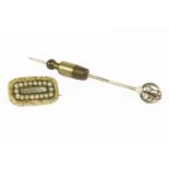 An Art Deco diamond and seed pearl stick pin, (pearl untested) marked 15ct (replacement pin), and