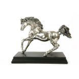 An Italian filled silver figure in the form of a prancing horse, on ebonised plinth socle, stamped