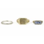 A wedding ring with floral decoration marked PLAT 2.66g, a gold three blue paste stone and synthetic