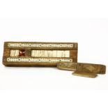 A 19th century Napoleonic Prisoner of War games box, with cribbage board and dominoes, pine and