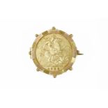 A 1909 half sovereign, set in a gold brooch mount, stamped 9ct, pin not gold