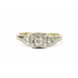An Art Deco single stone diamond ring with diamond set shoulders, marked 9ct and PLAT,2.34g