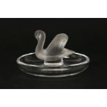 A small Lalique pin dish surmounted by a swan, with engraved signature to the base, 6cm tall