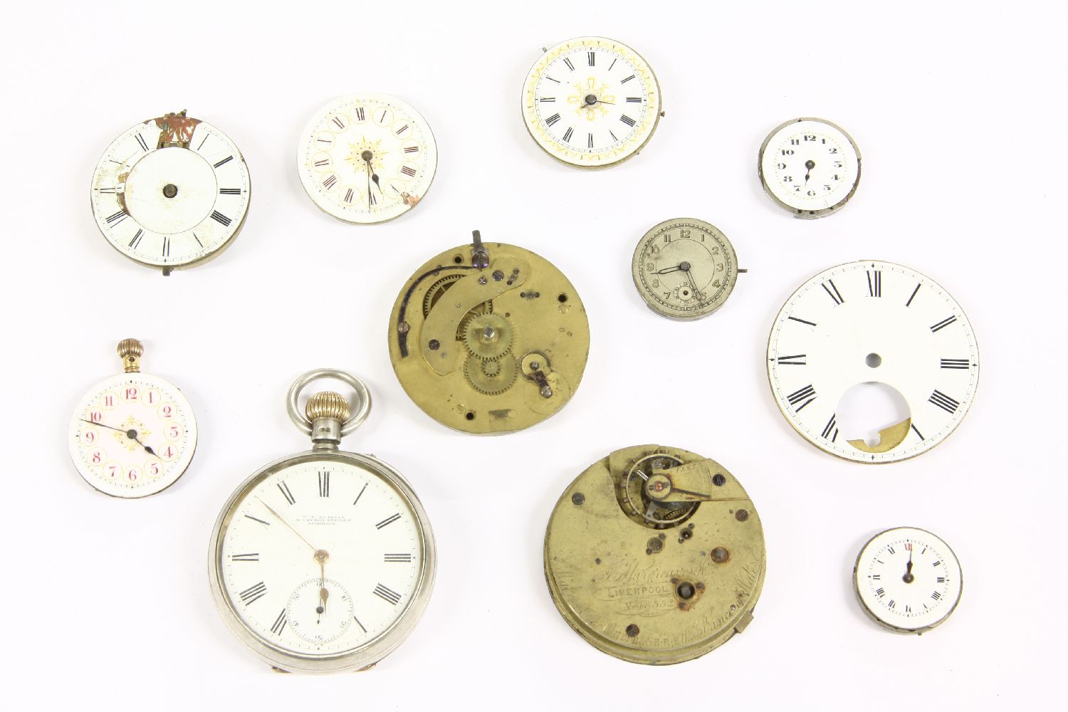 Assorted pocket and fob watch dials and movements, to include a silver pocket watch, dial signed T E