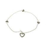 A Sterling Silver Tiffany Triple Heart Station Lariat bracelet, with triple heart stations, and a