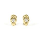 A pair of 18ct gold single stone diamond stud earrings, with post and Omega stud fitting, London