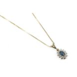 A 9ct gold blue topaz and diamond cluster pendant, on a gold box-link chain, marked 7503.68g