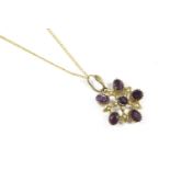 An Edwardian gold amethyst and split pearl openwork pendant, marked 9ct on gold chain3.53g