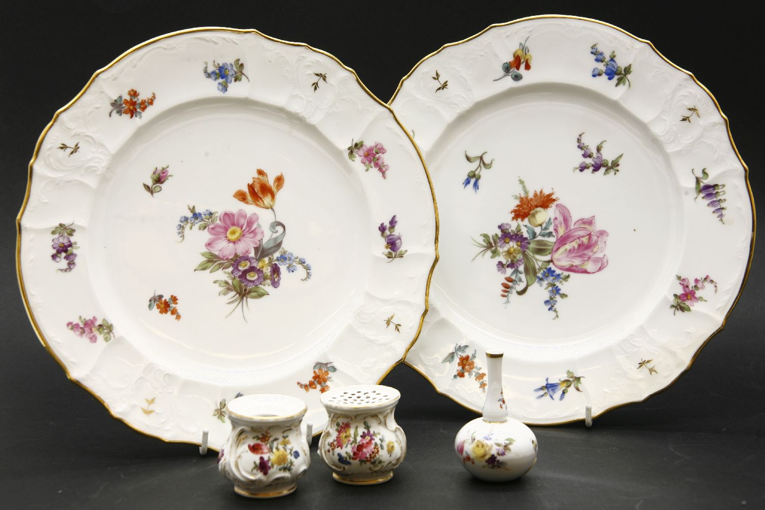 A pair of 'Meissen' type plates, painted with flower sprays, one with crossed swords mark, 25cm, a