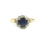 A gold sapphire and diamond circular cluster ring, marked 9ct4.06g