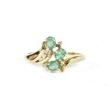 A gold emerald and diamond spray cluster ring, marked 375