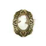 A Victorian complevé black enamel memorial brooch, with later added shell cameo