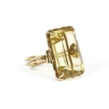 A gold emerald cut citrine ring, claw set to a scalloped border and double wire shank8.76g