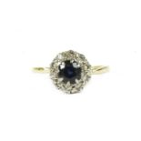 An 18ct gold round cut sapphire and diamond cluster ring, finger size M½ leading edge,2.83g