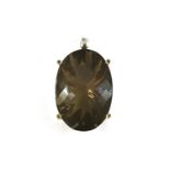 A large silver oval chequer cut smokey quartz pendant, with laser cut pavilion, four claw set with
