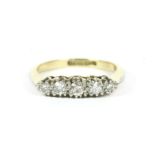 A gold five stone graduated diamond ring, marked PLAT and 18ct, finger size J,2.84g