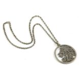 A large sterling silver circular zodiac or pierced textured lion pendant, by Deacon & Francis, c.